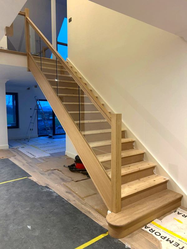 Straight staircase with glass balustrade, manufactured and fitted
