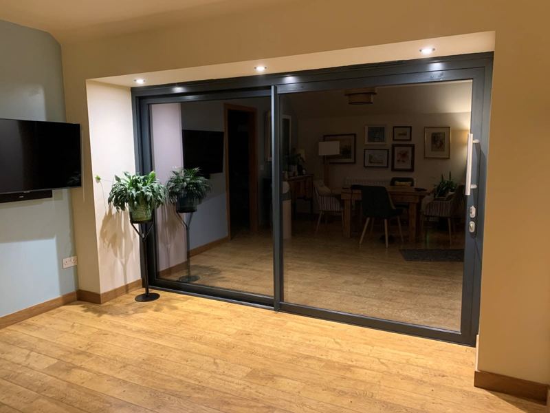 Extension with structural work for new sliding door, after