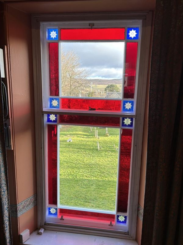 Sash and case window reglazed with new bespoke stained glass